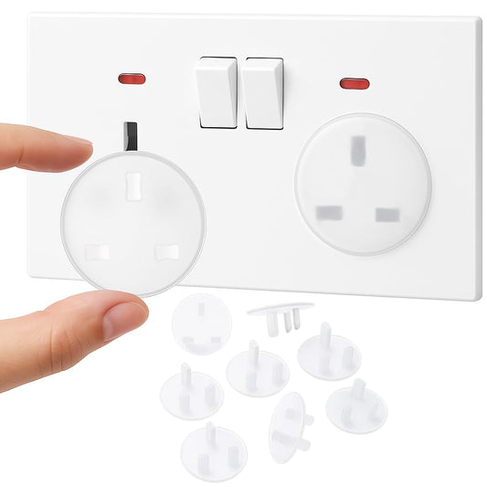 Clear UK plug socket cover installed in wall outlet