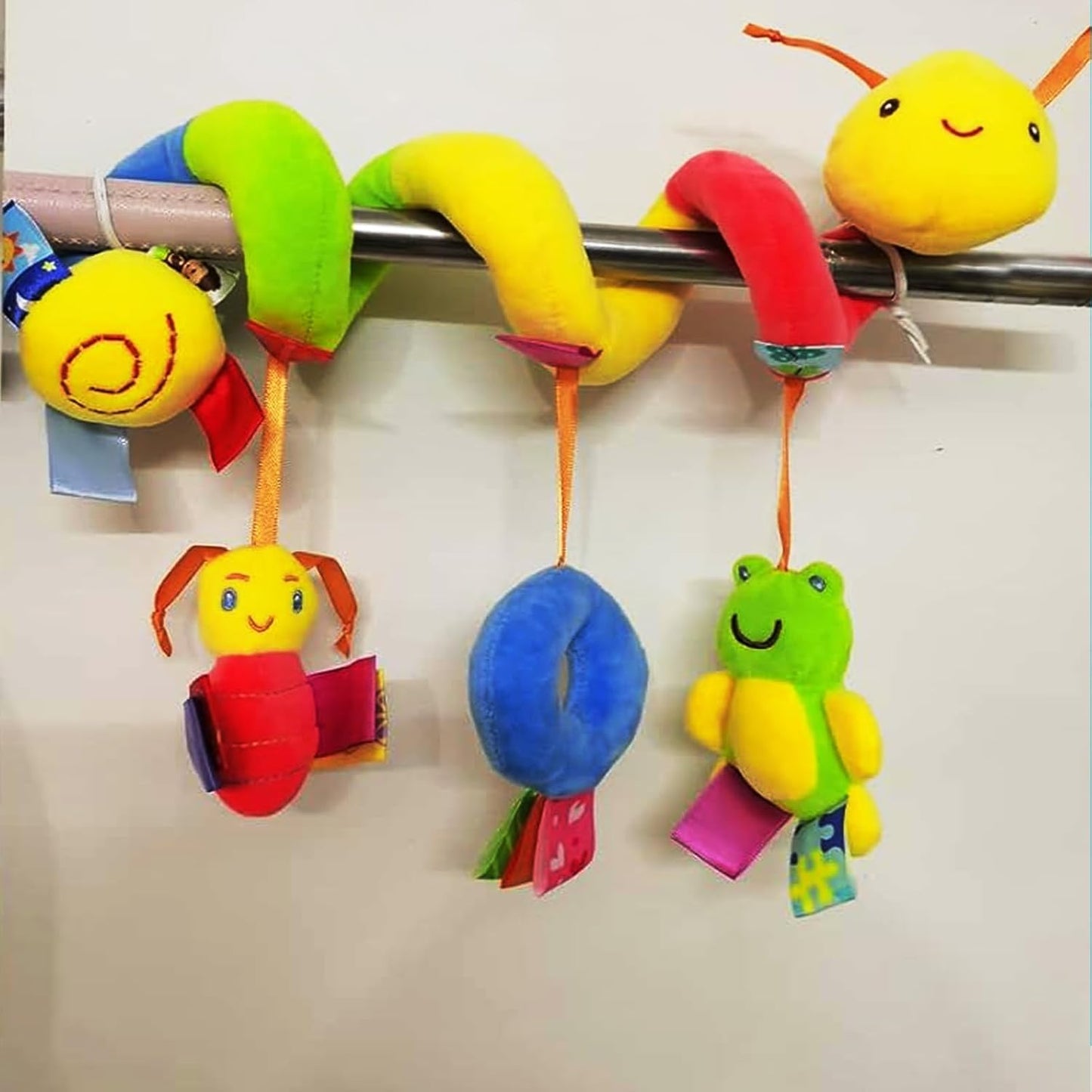 Colorful baby toy with hanging animals on a white background